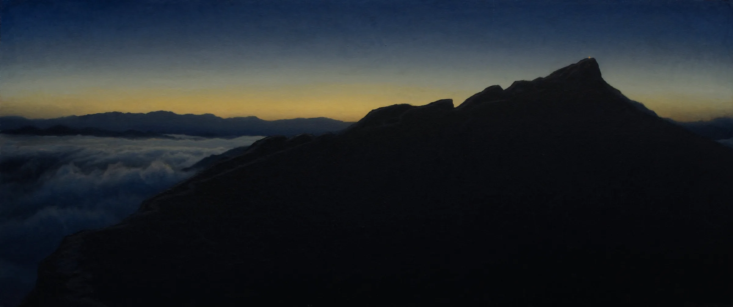 A single ridgeline climbing through a sea of clouds at dawn to a lamp-lit summit